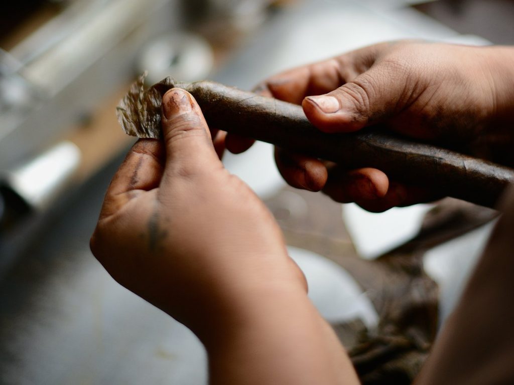 A roller’s hands finishing the wrapper on a cigar in our Estelí factory